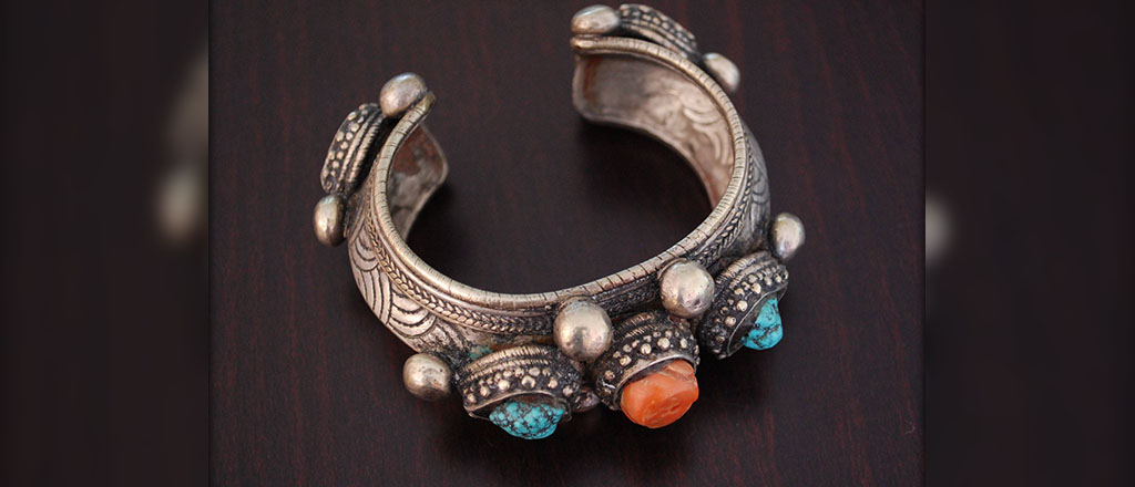 An ethnic bangle adorned with gemstones